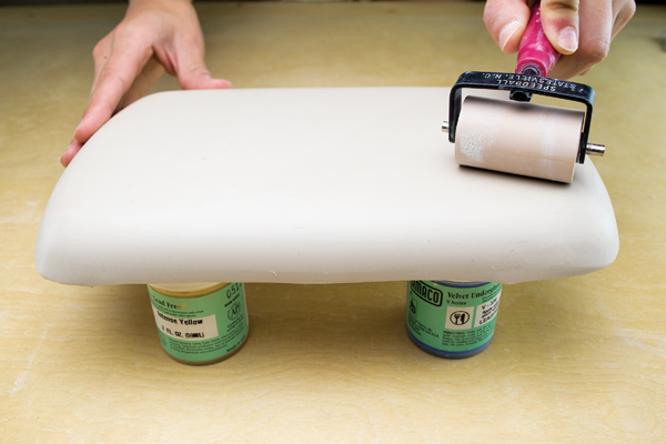5 Drape the printed slab over the cookie tray hump mold. Compress it to fit the form.