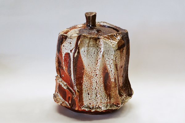 8 Faceted shino lidded jar, 8¾ in. (22 cm) in height, wood-fired stoneware, fired to cone 10, 2017.