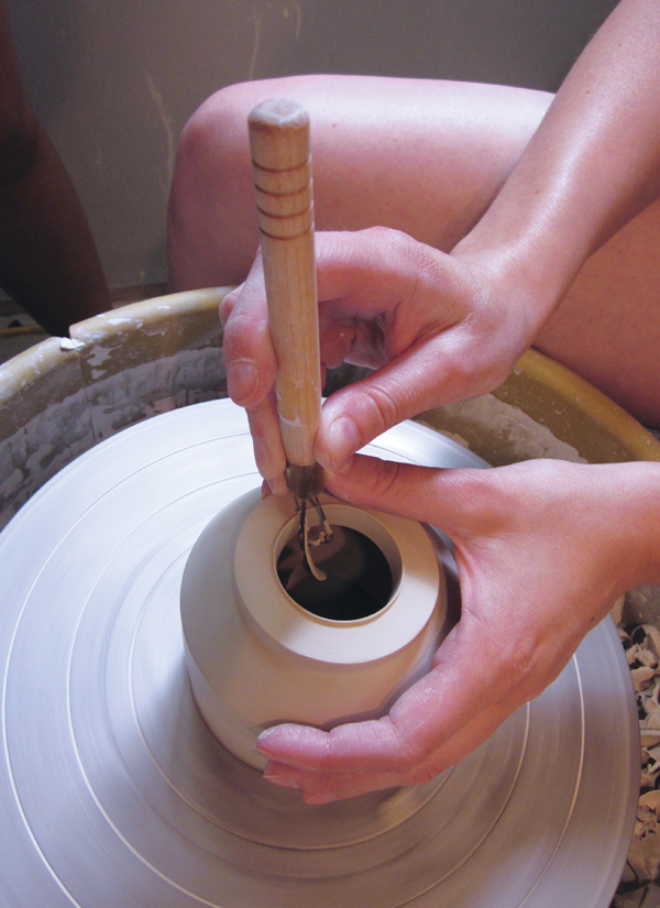 3 Trim the outer cup with a wide foot and cut away the clay inside the foot ring.