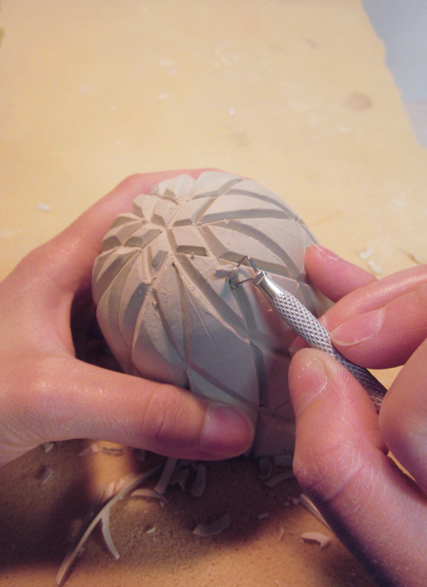 12 Carve each side of the V wider with a loop tool.