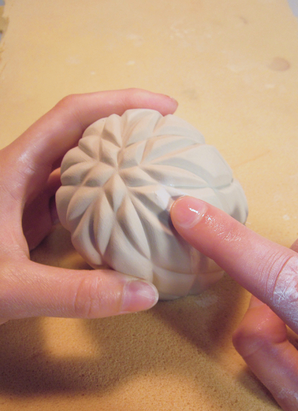 13 Soften the carved edges using a wet finger and a sponge.