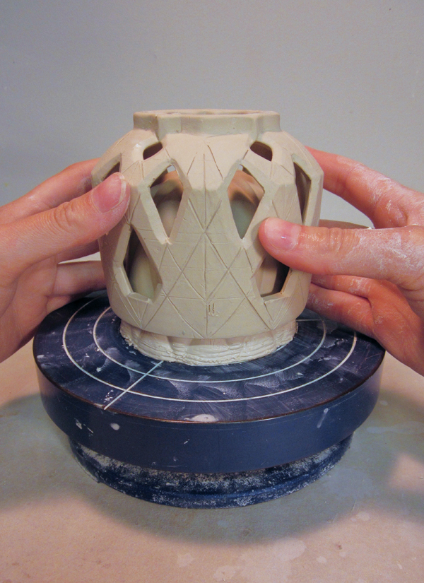 14 Wet and score both rims, then slide the outer layer down onto the inner cup.