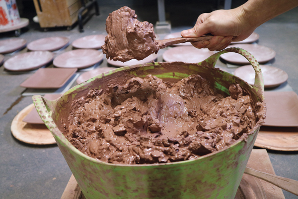 3 With some daily monitoring of the moisture level, I aim to create a full bucket of slop that is soft and scoopable.
