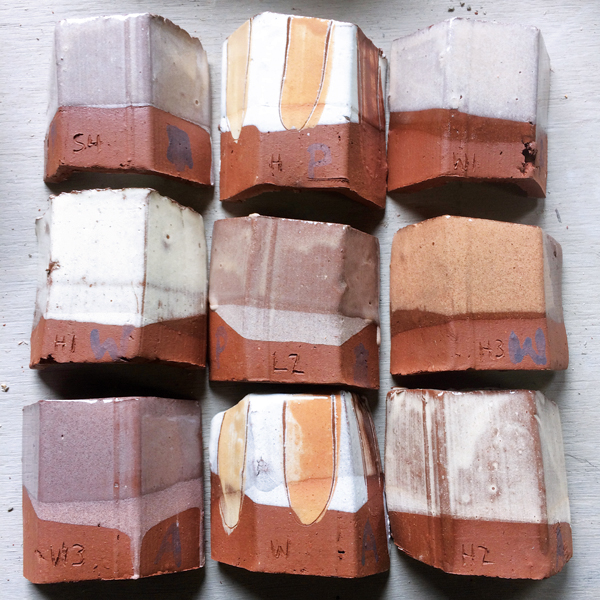 5 Test tiles of raw clay slips.