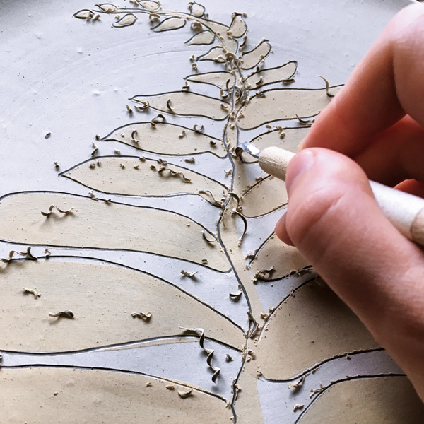 7 Accentuating a design with sgraffito lines.