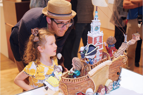 5 Garth Johnson and his daughter enjoying the Tempe Center for the Arts ceramics exhibition. 