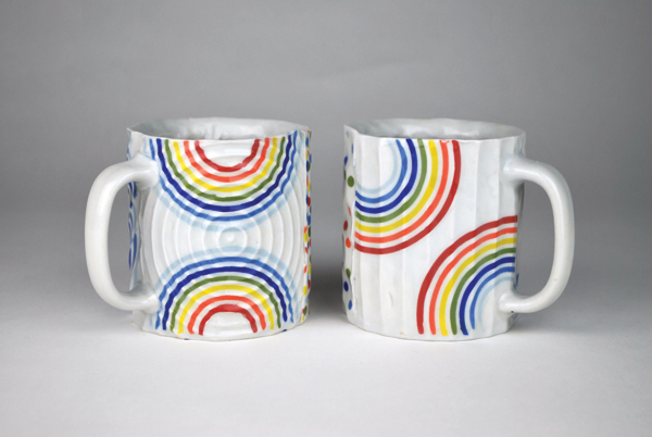 7 Mugs, press-molded porcelain, slip-cast inclusions, fired to cone 6 in reduction, 2018.