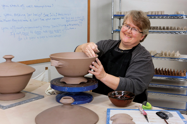6 Julia Mann, a resident potter and mentor at The Village Potters Clay Center. 