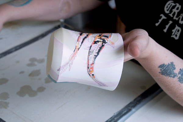 6 Paint wax resist over and around the images creating 1/8–1/4-inch-wide halos.