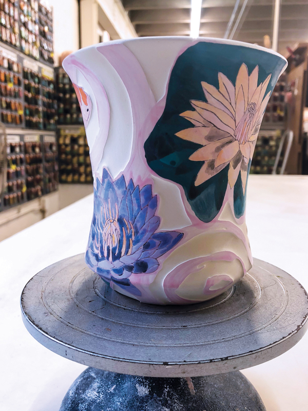 8 Apply another layer of wax to protect the surface from absorbing any underglaze.