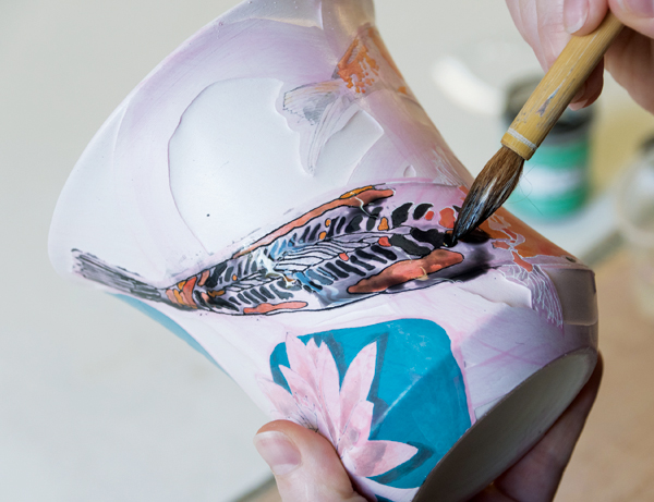 10 Apply a wash of diluted black underglaze over the lines carved through the wax.