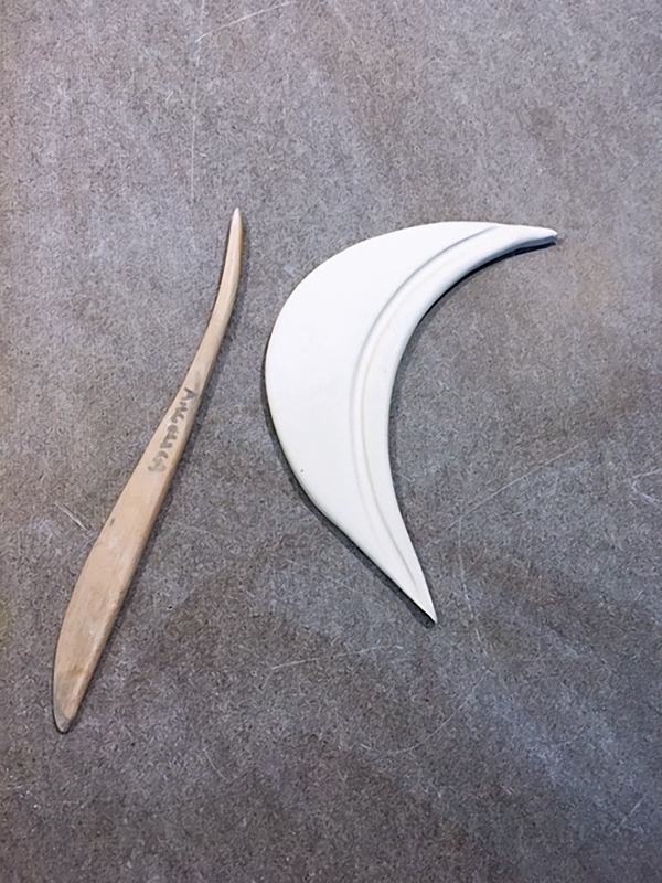 16 Cut, compress, and prepare the guard from a slab of clay.