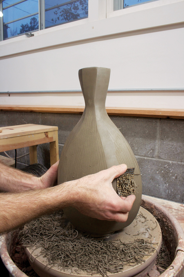 8 Carve away a thin 1/8–1/4-inch layer of clay to further refine the edges.