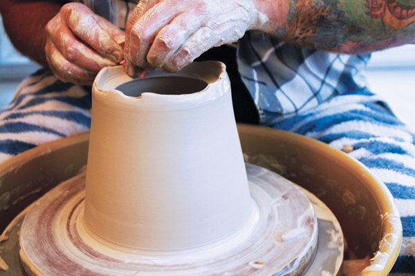 2 An extra-deep lid gallery allows for cutting away clay with a wire tool to create a scalloped lip. Smooth the rim with a chamois.