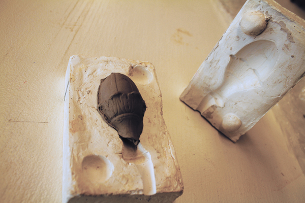 8 A knob is made from a press mold and attached to the lid.
