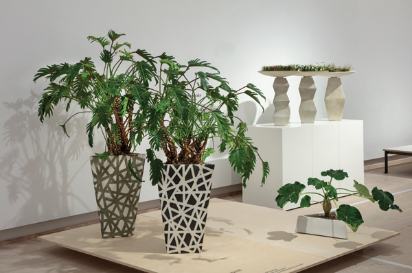 1 Ane-Katrine von Bülow’s triangular floor pots, 24½ in. (62 cm) in height, glazed stoneware, slab technique, silk-screen decoration, philodendron xanadu, 2014–18. Photo: Ole Akhøj.  