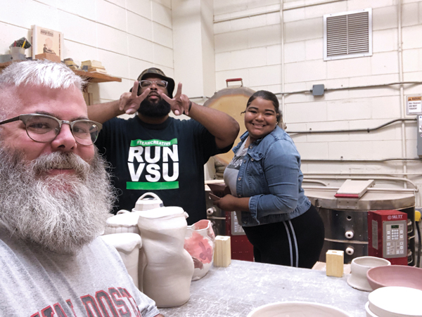 5 Loading bisque kilns with students Alexis Bass and Darian Harris of Valdosta State University, 2018. 
