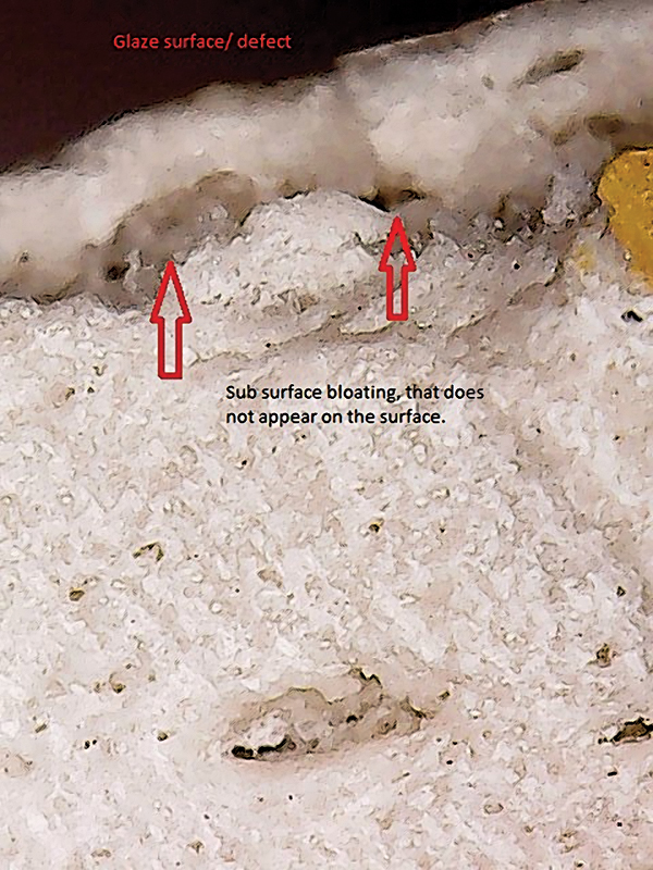 3 Cross section of sub-surface bloating. Note crazing line on glaze surface directly above cavity.