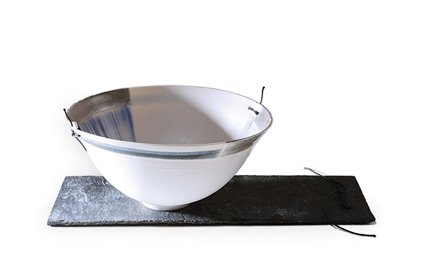 3 Moya Tosh’s Winter, 9 in. (23 cm) in width, wheel-thrown porcelain, glaze, fired to 2300°F (1260°C), silver leaf, leather stitching, 2017. Photo: Elizabeth Vickers Photography. 