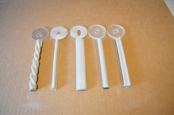 7 Extrusion designs, each with their accompanying die.