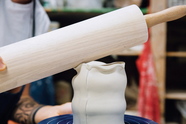 4 Use the rolling pin to make gentle taps on the foot in the spaces between each dent.