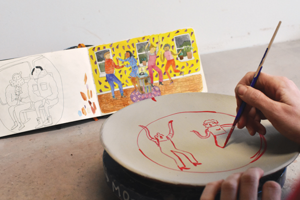 8 Red watercolor burns out in the firing, so use it to sketch a drawing. Pick an image that works well for your plate and draw it over the slip.