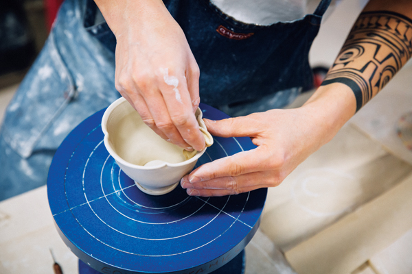 8 To accentuate each lobe, use a moist chamois and press out on the rim while supporting the cup with your other hand.