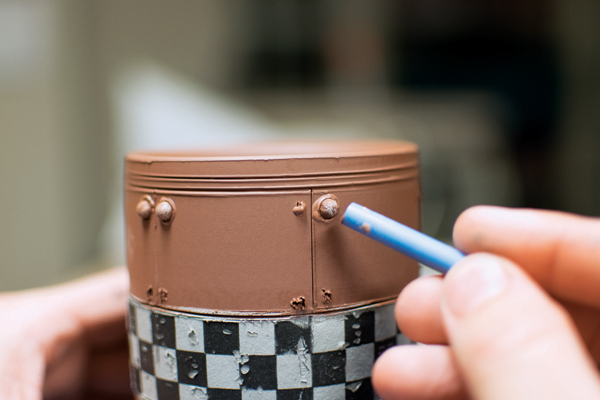 9 Apply the rivets to scored marks using a half-sphere sprig mold and slip.