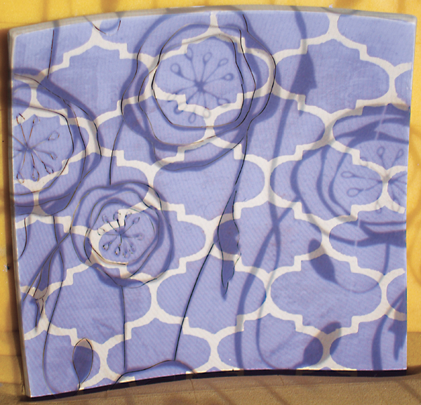 10 Project a contrasting pattern and use an X-Acto knife to carve it in.