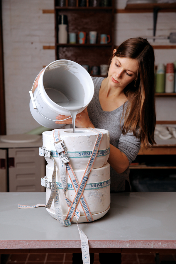 13 Fill with dark gray casting slip, drain, then fill with white slip to develop thickness.