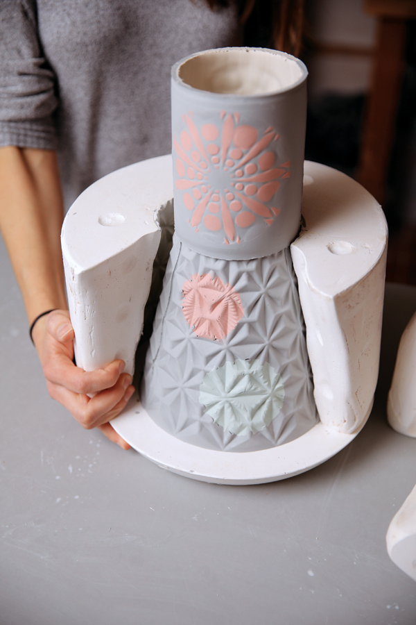 14 Disassemble the mold to reveal the dark gray exterior and white interior.