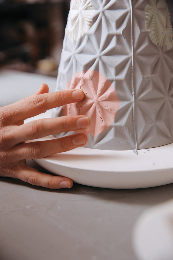 15 When the clay is leather hard, compress any cracks in the patterns.