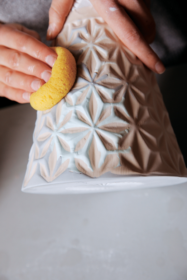 16 Apply a glaze over the texture, then use a sponge to remove it from the raised areas.