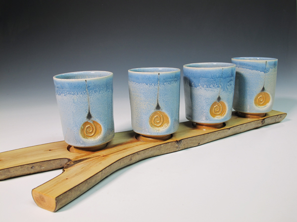 4 Tumbler set, 20 in. (51 cm) in length, wheel-thrown and handbuilt white stoneware, off-white terra sigillata, black slip trailing, variation of Bruce Dehnert’s Celadon, fired to cone 11–12, 2018.