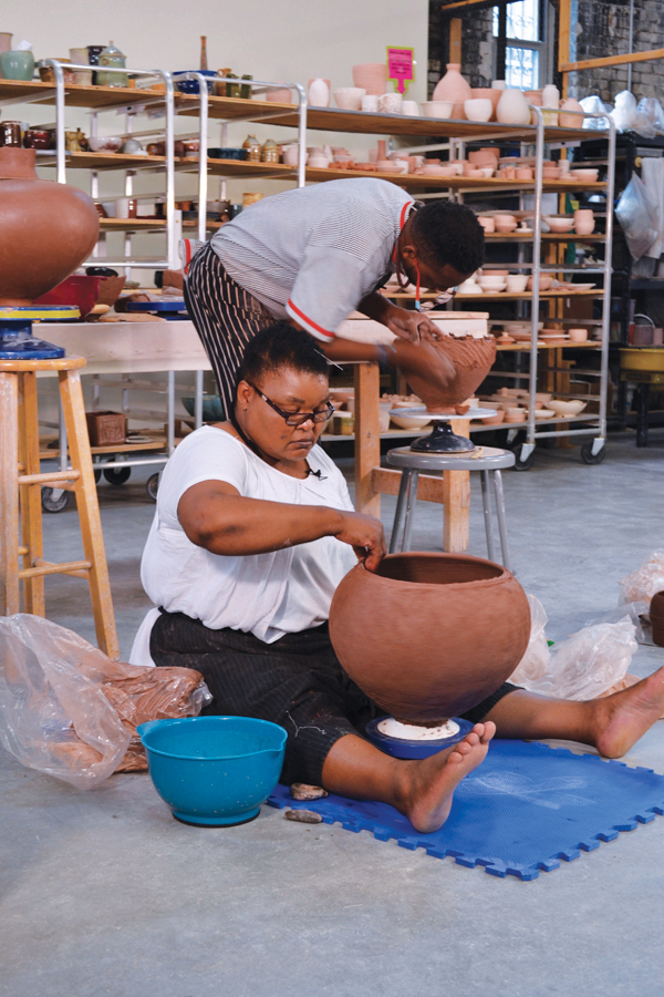 6 Jabulile Nala and Clive Sithole (Thembile Nala not shown), ceramic demonstration. Isikhathi Sethu: Our Time workshop, Mudflat Studios, Somerville, Massachusetts, July 22, 2018. Photo: Elizabeth Perrill. 