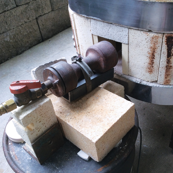 2 The combustion chamber is 4.5 inches in height. The gas valve is set three-quarters open and the primary air is open 1.5 turns.