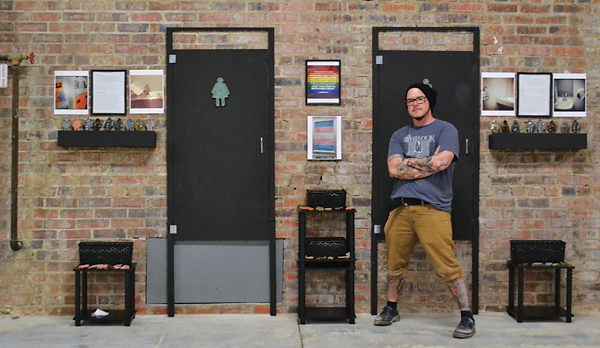 5 Mac McCusker with their Policing Gender installation. 