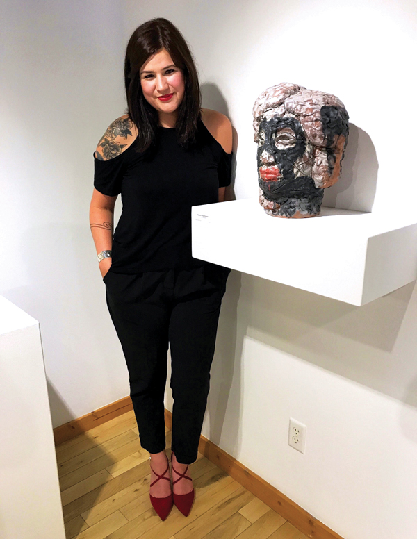 1 Raven Halfmoon with her ceramic art.