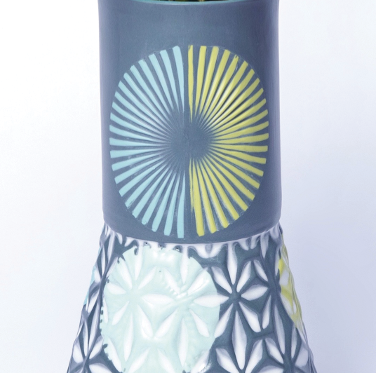 17 Fired flare vase showing contrasting textured and colored slip-cast areas.