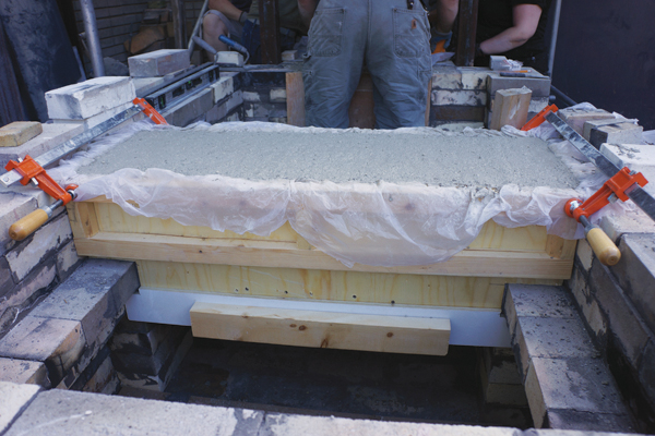 5 On day 3, the castable for the flue from the firebox to the main kiln chamber was mixed, poured, and allowed to set for 24 hours.
