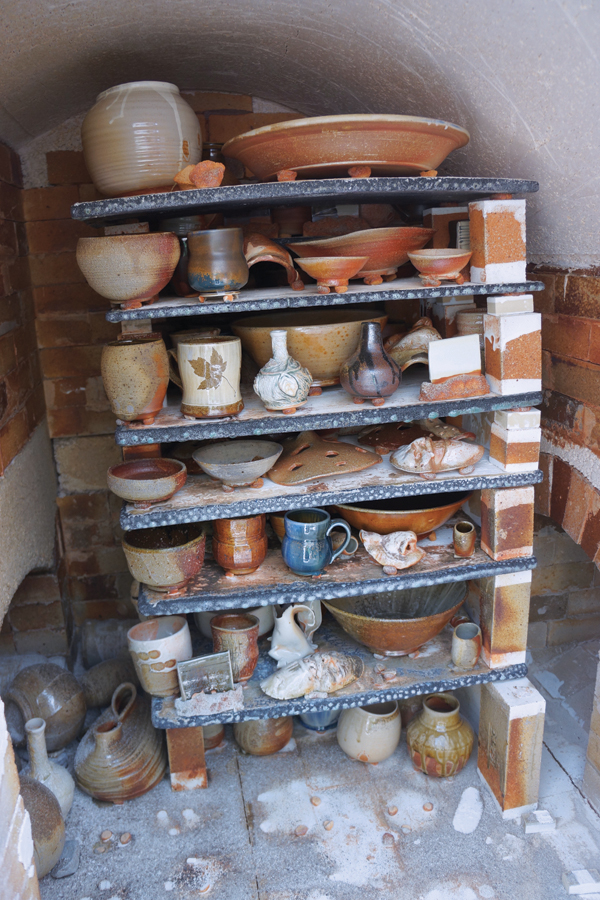 9 Unloading the kiln after the first firing. 