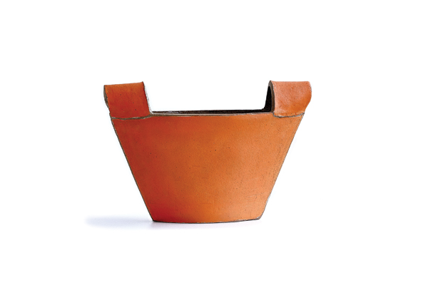 1 Installation from the exhibition “Joy of Color,” Orange Bucket, 24 in. (61 cm) in width, fired to cone 6 in oxidation, 2018. Photo: Uffe Kjaer. 