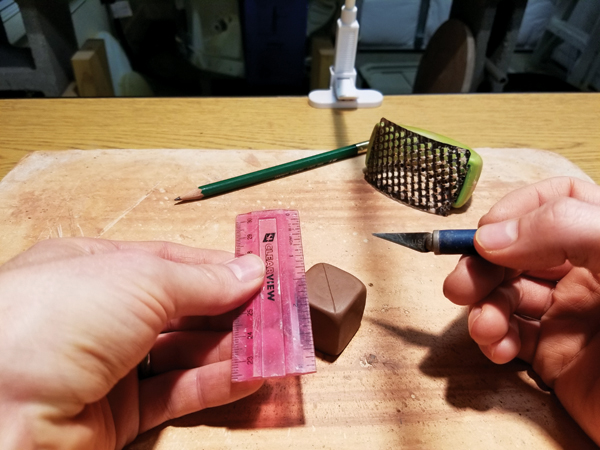 2 Drawing a line helps you remember the direction of texture on each side and keep the grating tool moving straight.