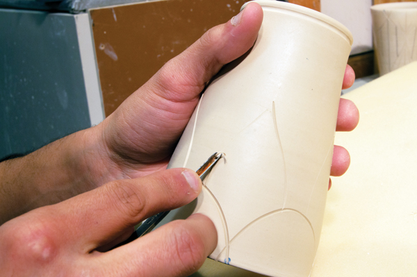6 Carve the traced lines using a V-gouge tool, working in one direction at a time.