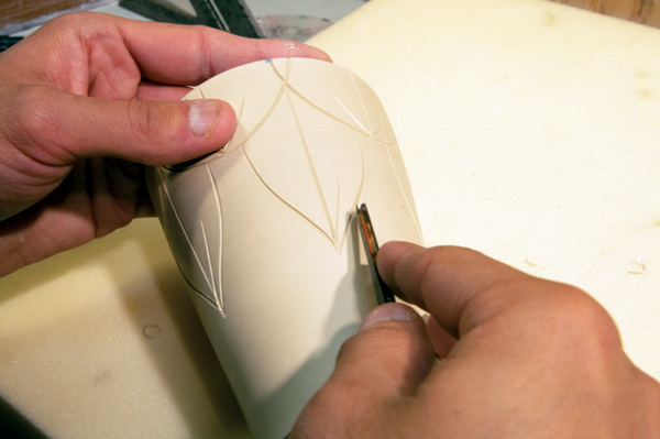 7 Fill in the previously carved outlines with additional curves and lines.