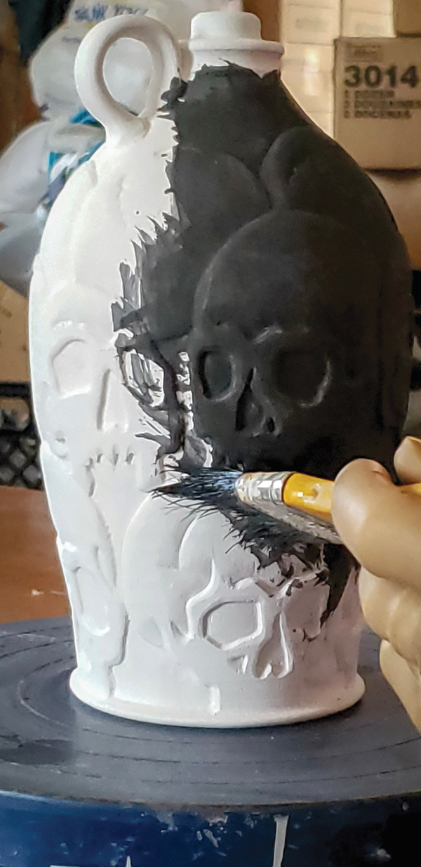 8 After bisque firing, apply a manganese wash (wear protective gloves and a mask) to the surface using a brush.
