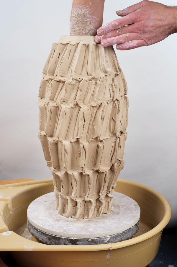 12 To open the vessel, work the rib evenly up and down the cylinder’s interior so you’re opening the whole piece together.