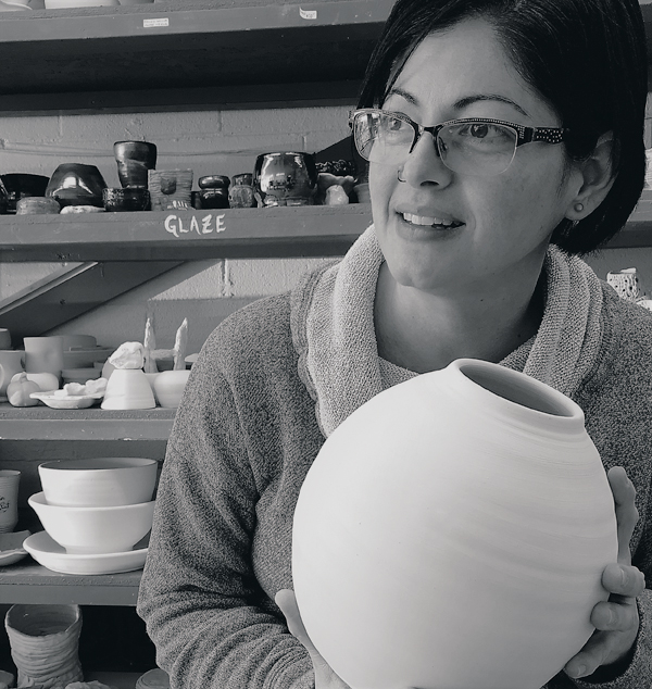 4 Lisa Bare Culp pictured with one of her wheel-thrown pieces.