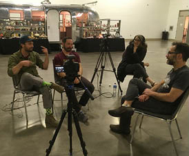 Simon chats with Justin Donofrio and John Cohorst in front of the Art Stream Nomadic Gallery.