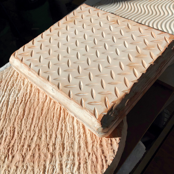 1 Plaster texture molds made from clay slabs pressed into interesting textures.